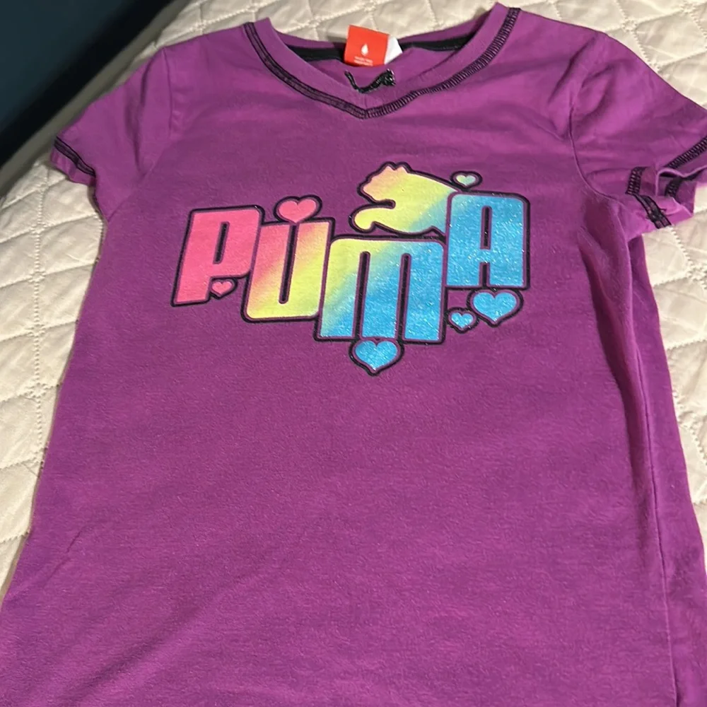 2 tee shirts and pair of shorts shirts are size girls medium. Puma and peanuts. - Picture 8 of 11